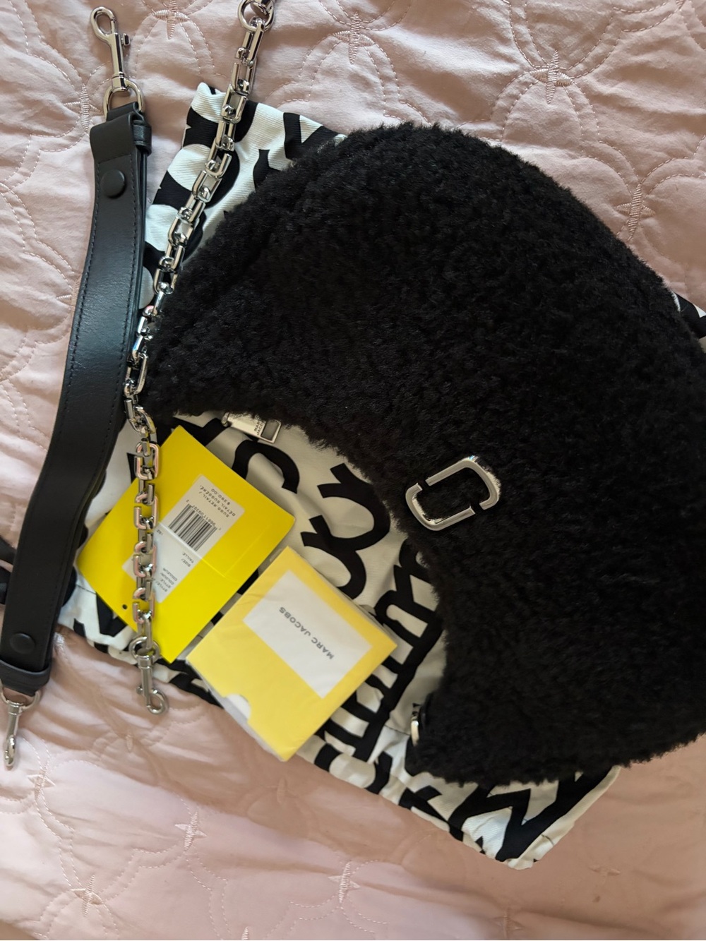 Marc Jacobs faux shearling shoulder bag with two straps.